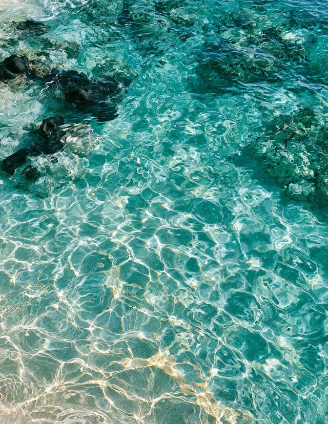 Sunlight through clear turquoise shallows