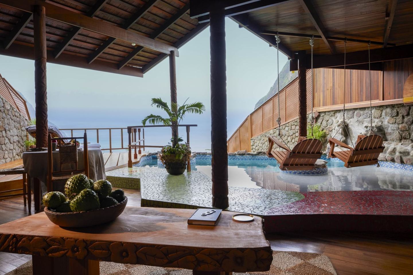 A Ladera heritage suite with its open fourth wall framing the Pitons.